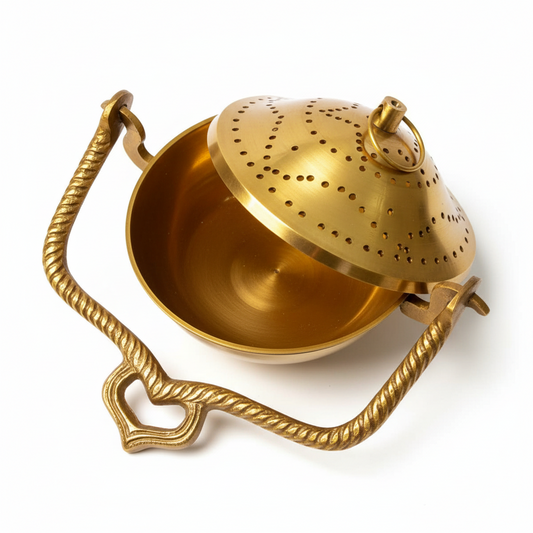 Brass tea infuser on a woven surface