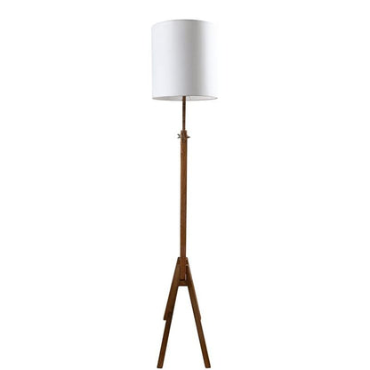 Floor lamp with wooden base and white shade on a white background