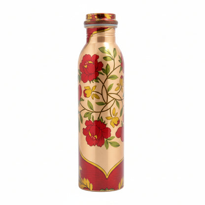 Decorative water bottle with floral design on a table