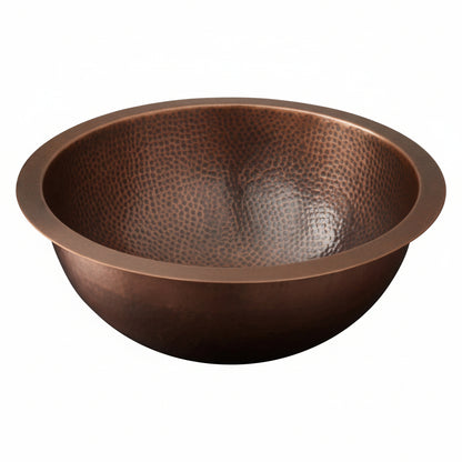 Copper sink with a textured surface on a white background