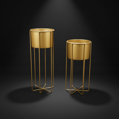 Two gold metal planters on stands against a dark background