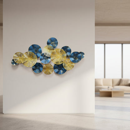Decorative wall art with blue and gold circular elements on a white background