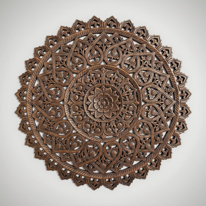 Decorative wooden wall panel with intricate carvings on a white background