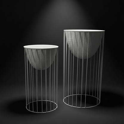 Two cylindrical wire mesh stands with round bases on a black background