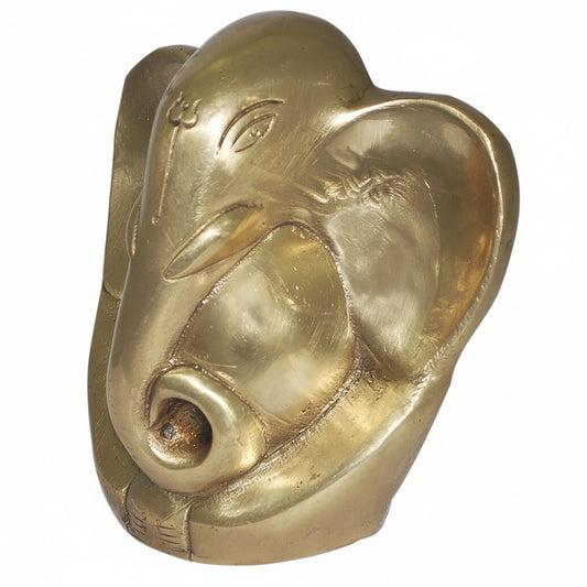 Brass pig head sculpture on a white background