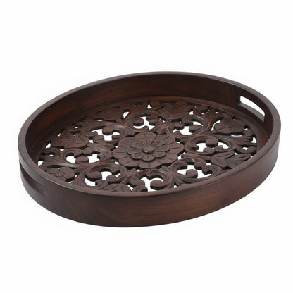 Decorative metal tray with floral patterns on a white background