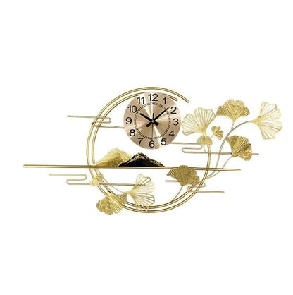Decorative wall clock with gold leaf design on a white background