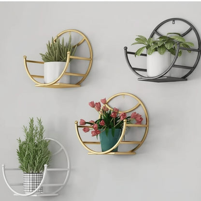 Decorative wall planters with plants on a light gray background