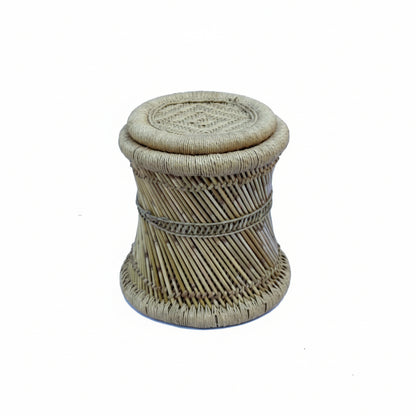 Rattan stool with woven design on a white background