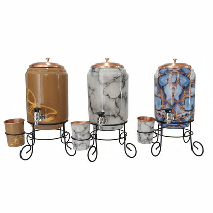 Decorative drink dispensers with marble and abstract designs on stands.