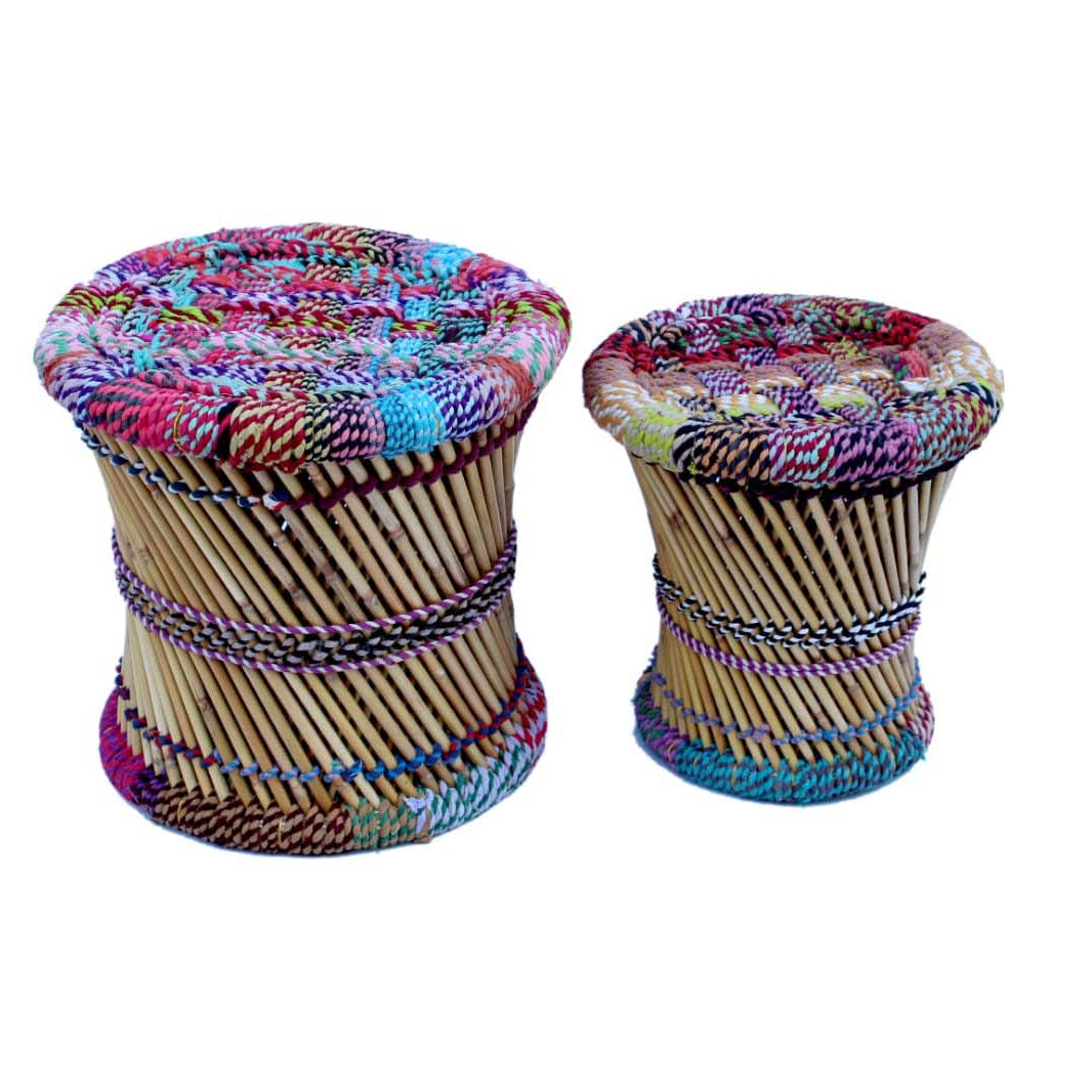 Two colorful stools with woven designs on a white background