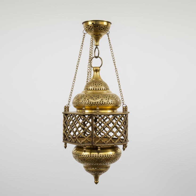 Decorative gold lantern with intricate designs on a light gray background