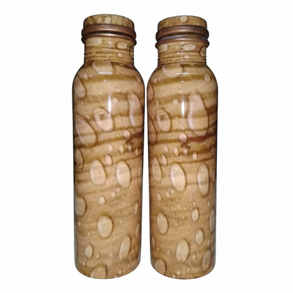 Two patterned bottles with brown and beige design on a white background