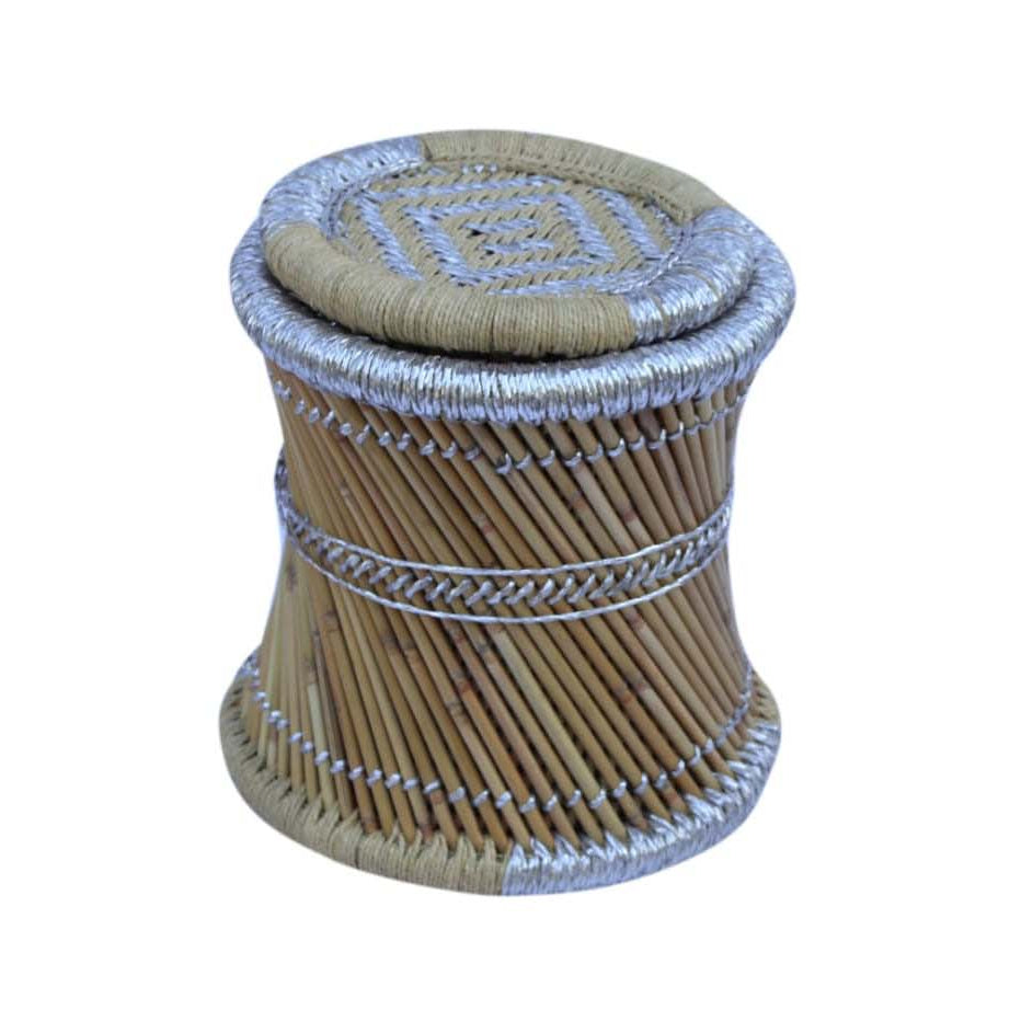 Woven cylindrical stool with a patterned top on a white background