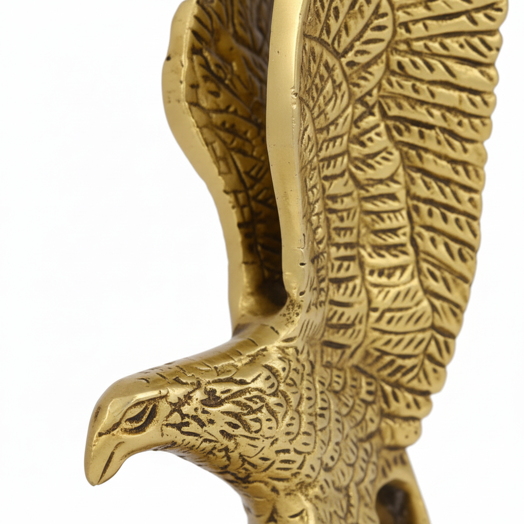 Gold eagle figurine on a white background