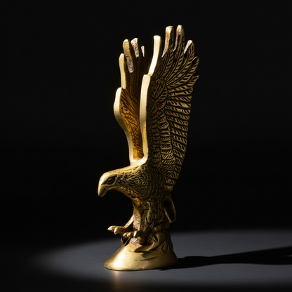 Gold eagle statue on a black background