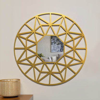 Geometric gold mirror on a wall with a living room reflection.