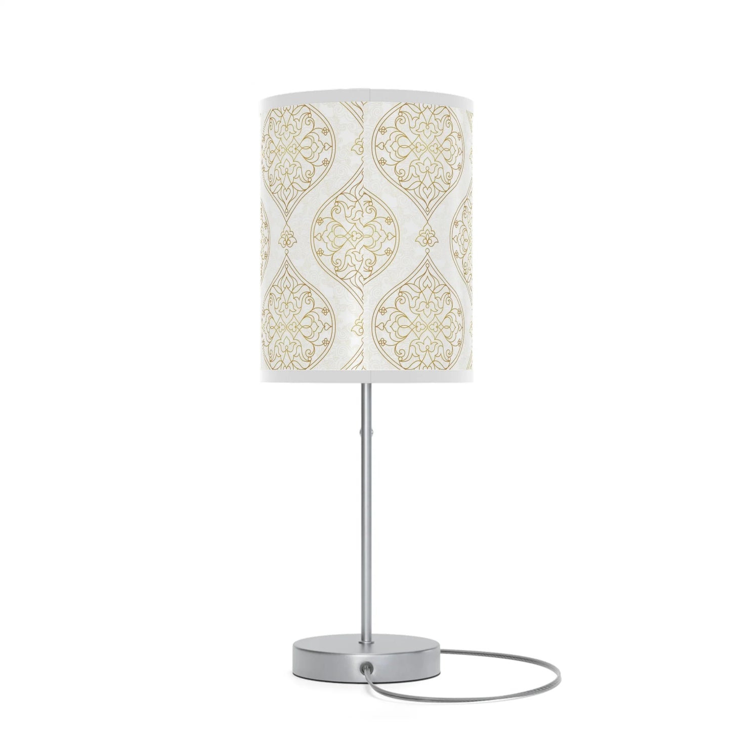Table lamp with a decorative white and gold patterned shade on a white background