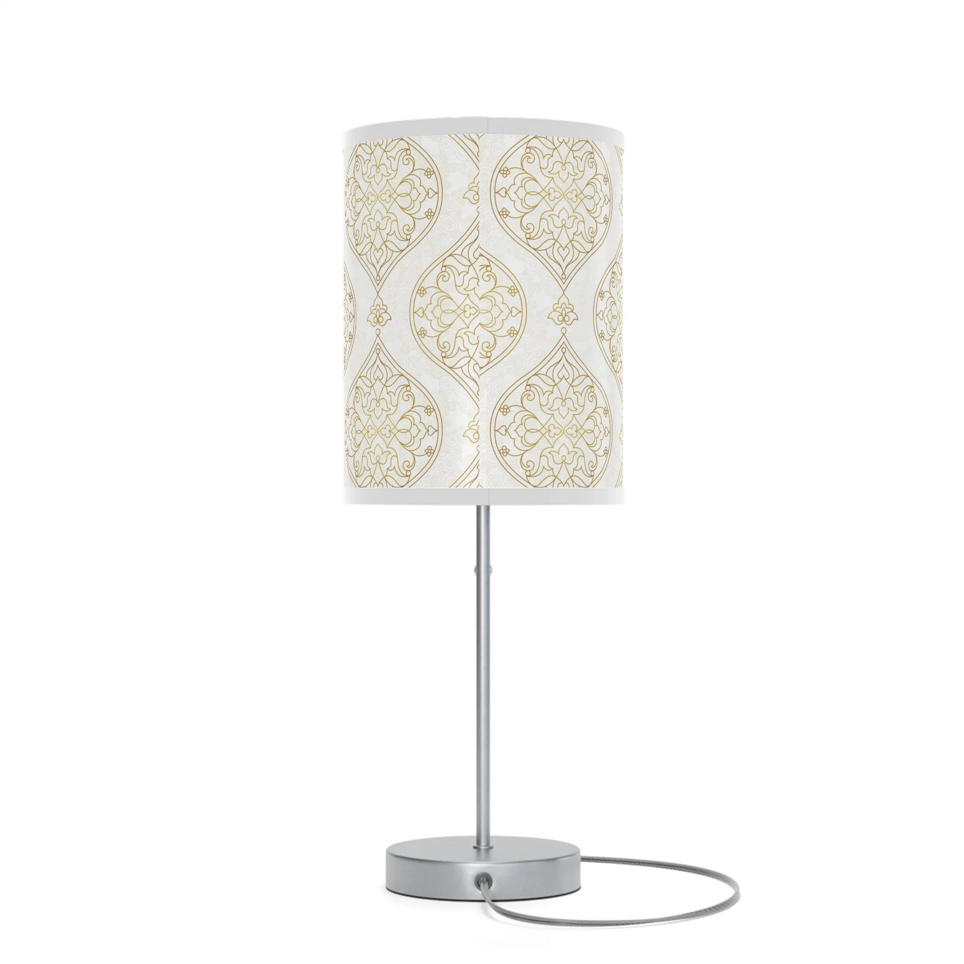 Table lamp with a decorative white and gold patterned shade on a white background