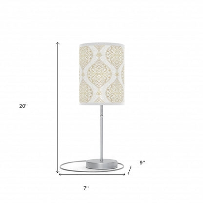 Table lamp with decorative shade and measurements on a white background