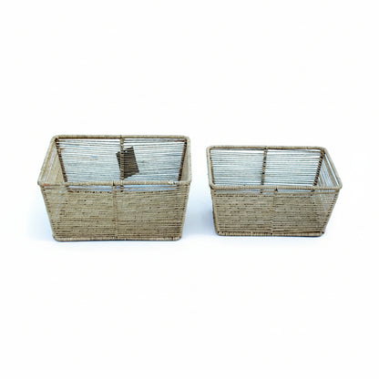 Two rectangular wire baskets on a white background