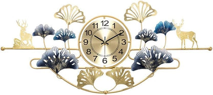 Decorative wall clock with gold accents, blue leaves, and deer figures on a white background