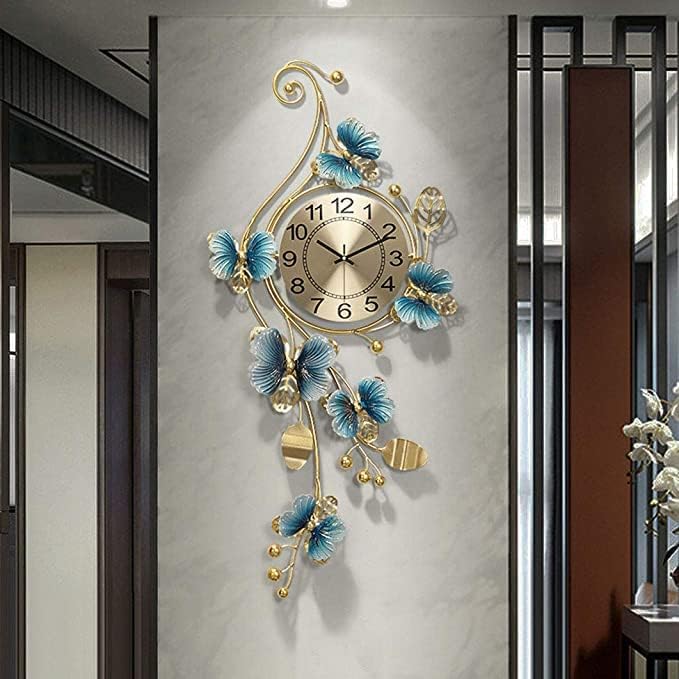 Decorative wall clock with floral designs on a gray wall.