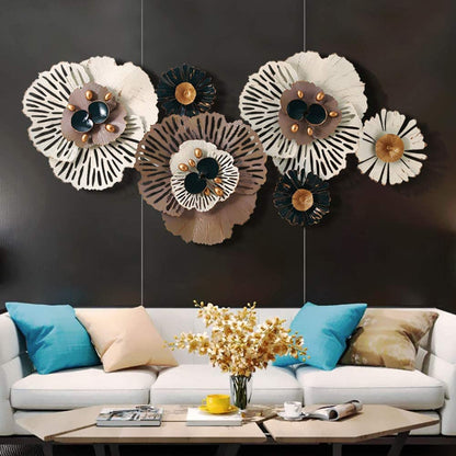 Decorative wall art above a white sofa with colorful pillows and a coffee table.