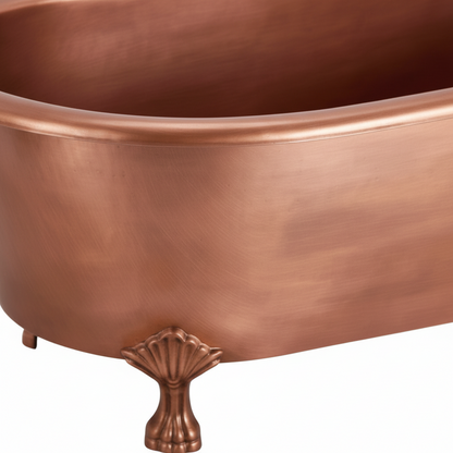 Copper bathtub with shell feet on a white background