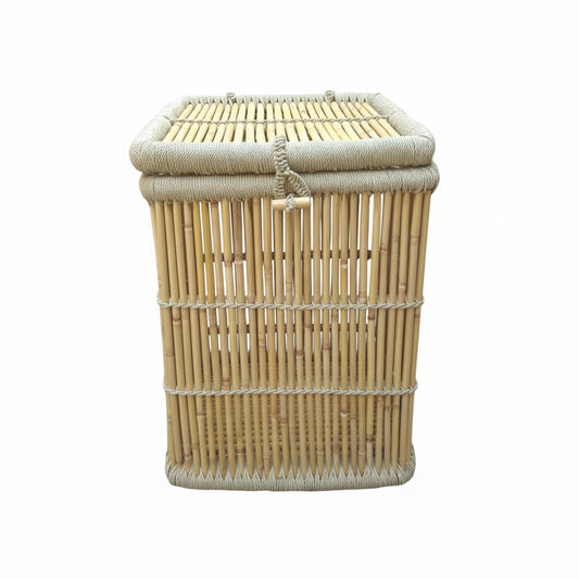 Woven bamboo basket with a lid on a concrete floor.