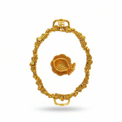 Decorative gold frame with a matching brooch on a textured white background