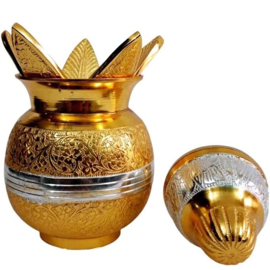 Decorative gold and silver urn with intricate designs on a white background