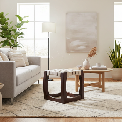 Modern living room with a sofa, coffee table, and decorative items.
