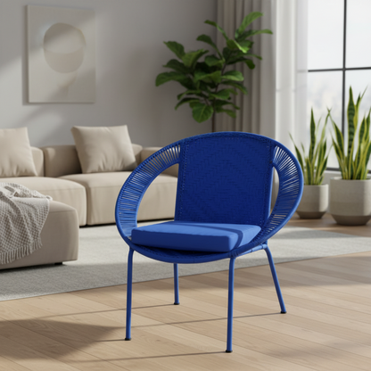 Blue chair in a modern living room with a beige sofa and plants.
