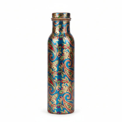 Decorative water bottle with intricate patterns held in front of a blurred background