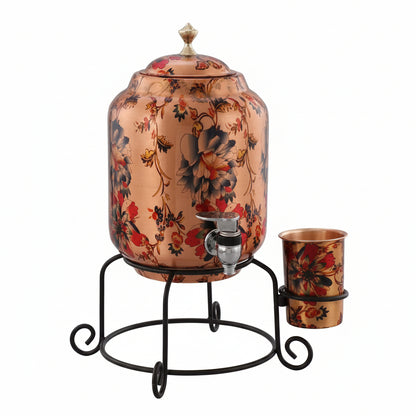 Decorative copper water dispenser with floral patterns on a stand against a light gray background