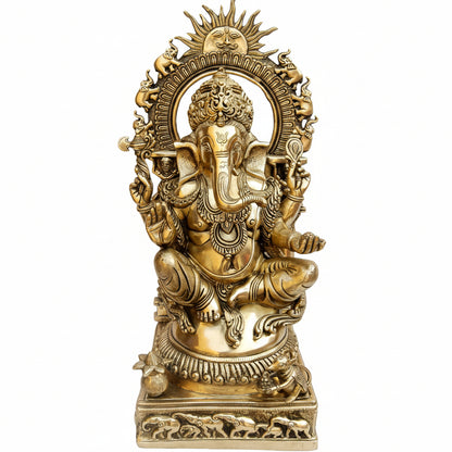 Decorative statue of a seated figure with intricate designs on a white background