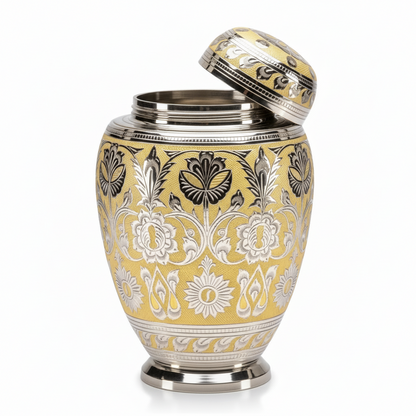 Decorative urn with intricate yellow and black patterns on a white background