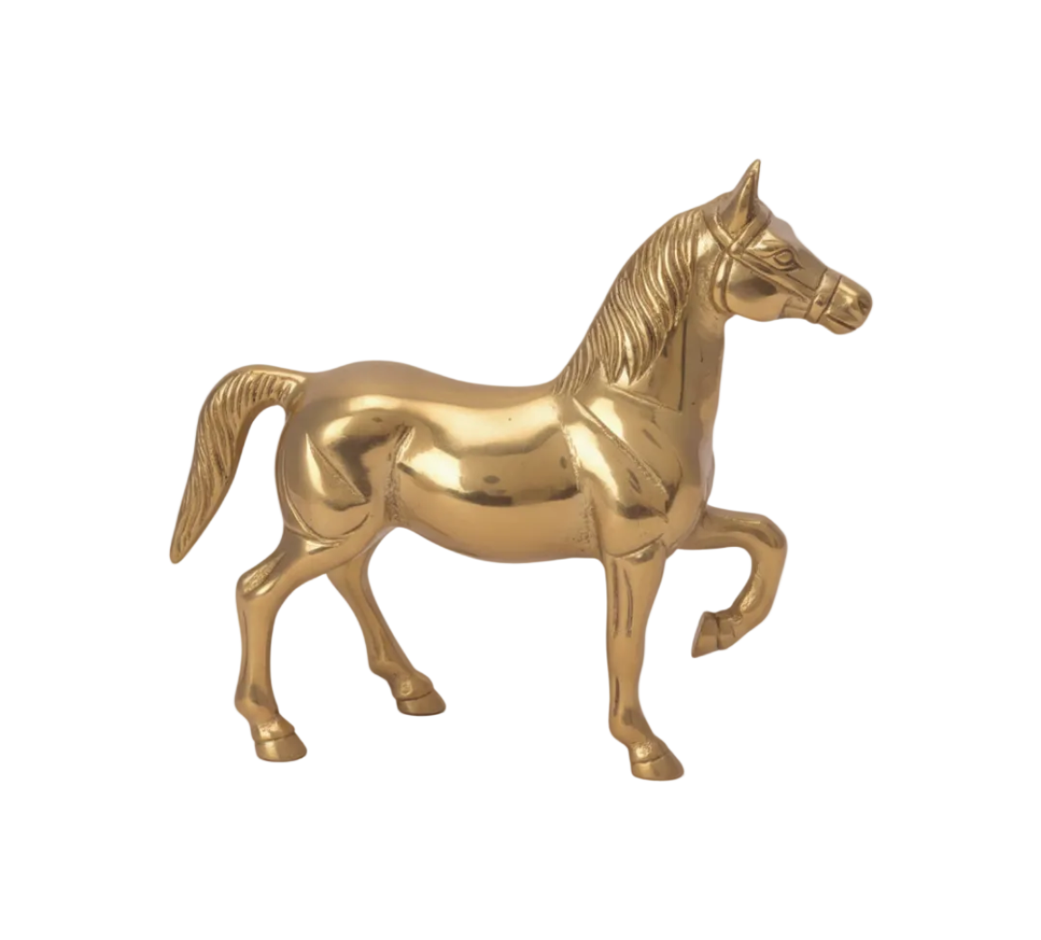 Gold horse figurine on a white background