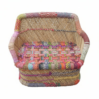 Colorful woven basket on a stone pavement