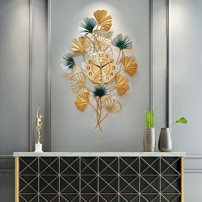 Decorative wall clock with leaf design on a gray wall