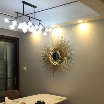 Modern interior design with a chandelier and decorative wall mirror.