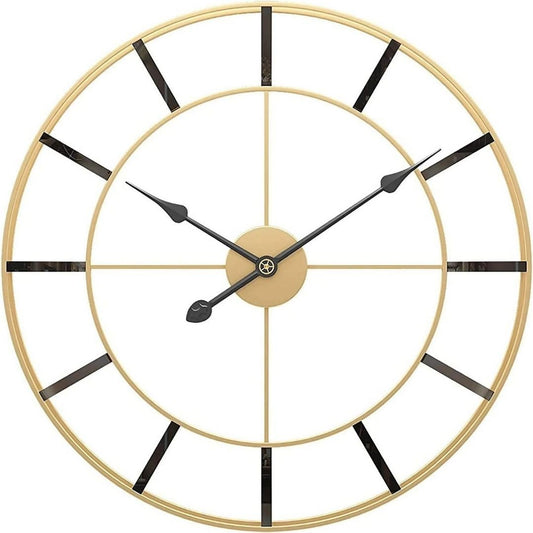 Gold wall clock with black Roman numerals on a white background