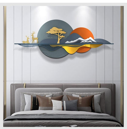 Decorative wall art above a bed with pillows on a light gray wall.