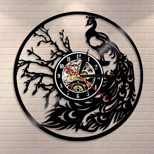 Decorative wall clock with peacock design on a brick wall background