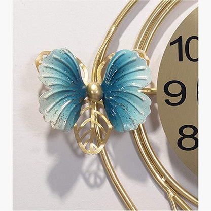 Decorative wall clock with a blue butterfly and gold accents