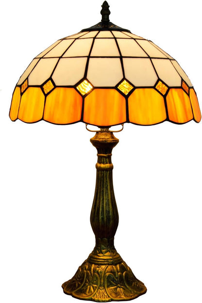 Vintage-style table lamp with stained glass shade on a white background