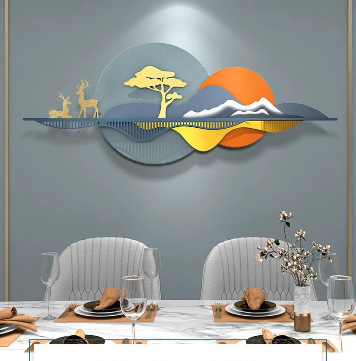 Decorative wall art with landscape design above a dining table set.