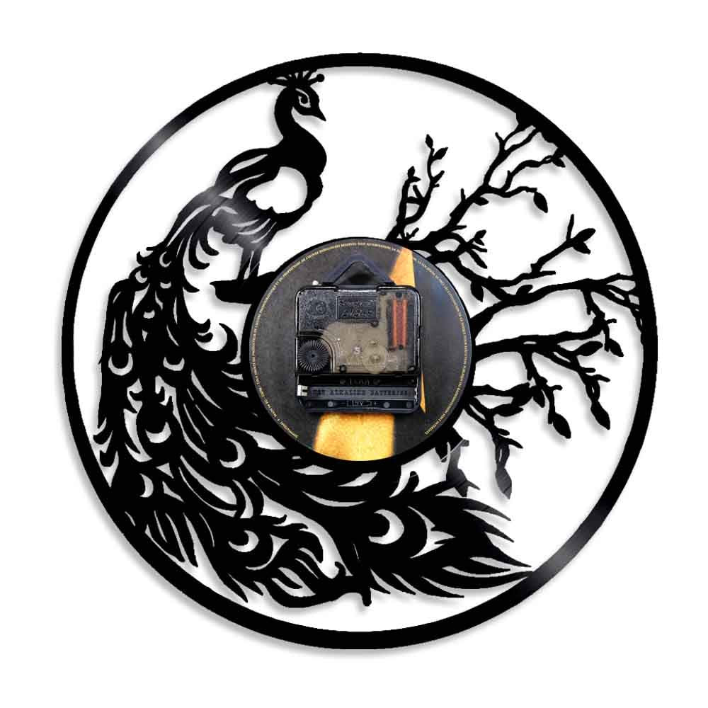 Decorative wall clock with peacock design on a white background