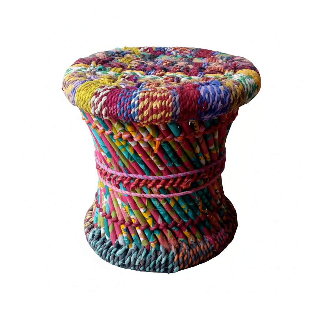 Multicolored woven stool on a concrete floor